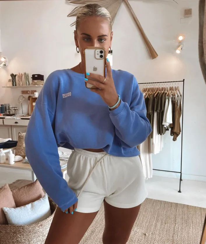 Oat at Papagayo Hotel Plaza Minimalist boutique with a soft neutral color palette, showcasing natural fiber baskets, skincare products, clothing, and lifestyle accessories.